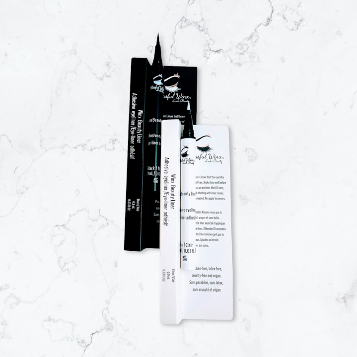 Adhesive eyeliners for strip lash application